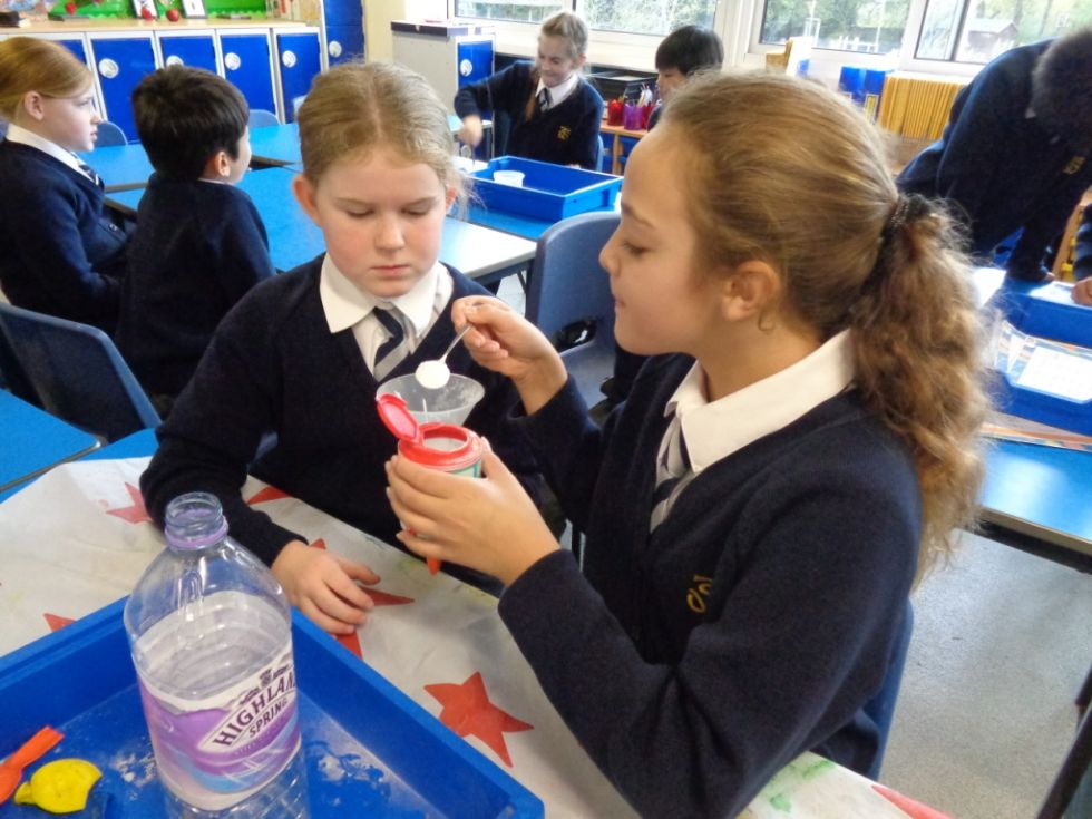 children measuring in science